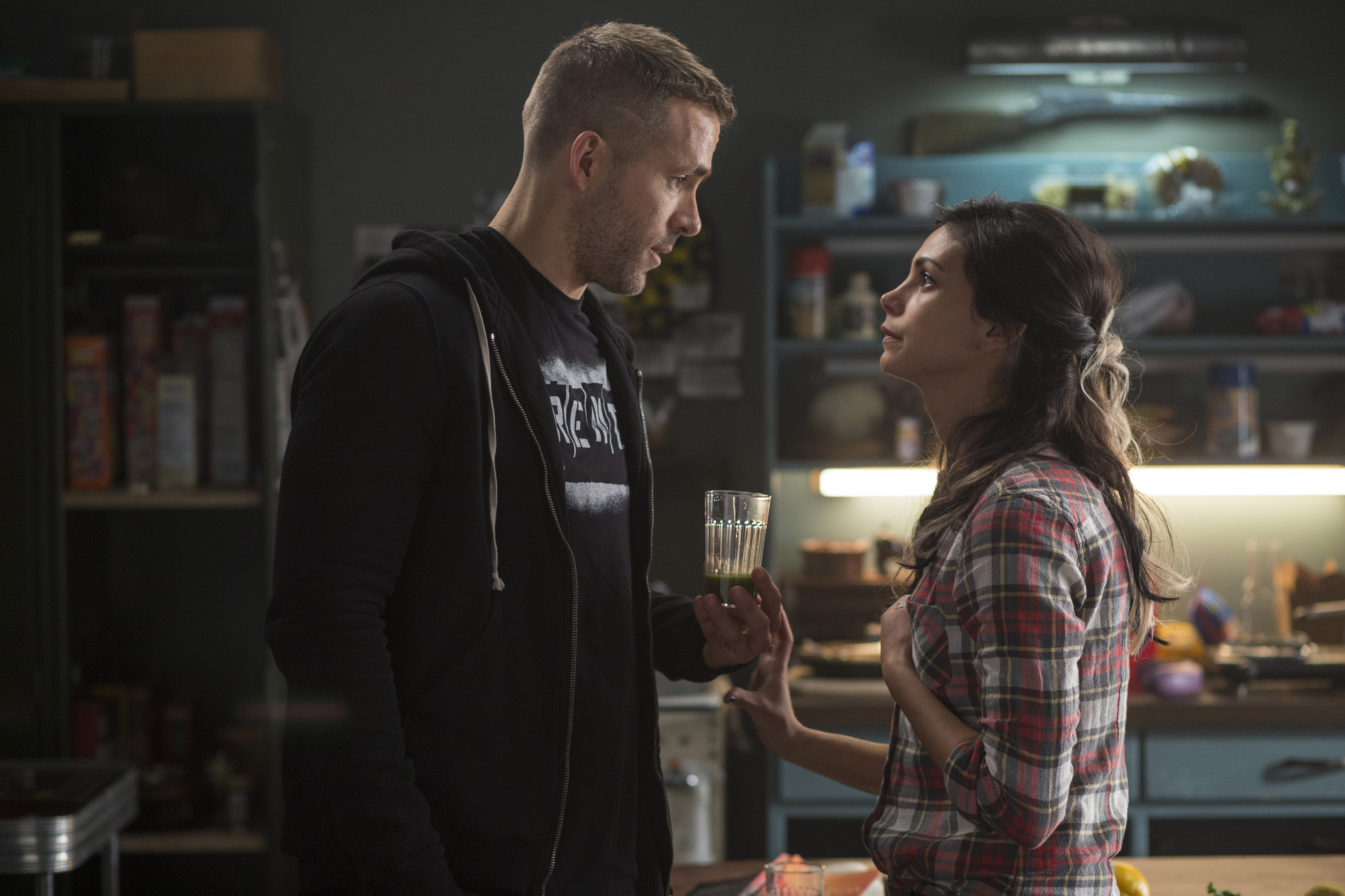 DEADPOOL Wade Wilson (Ryan Reyonlds) and new squeeze Vanessa (Morena Baccarin) trade some pointed barbs, in DEADPOOL. Photo Credit: Joe Lederer TM & © 2015 Marvel & Subs.  TM and © 2015 Twentieth Century Fox Film Corporation.  All rights reserved.  Not for sale or duplication.