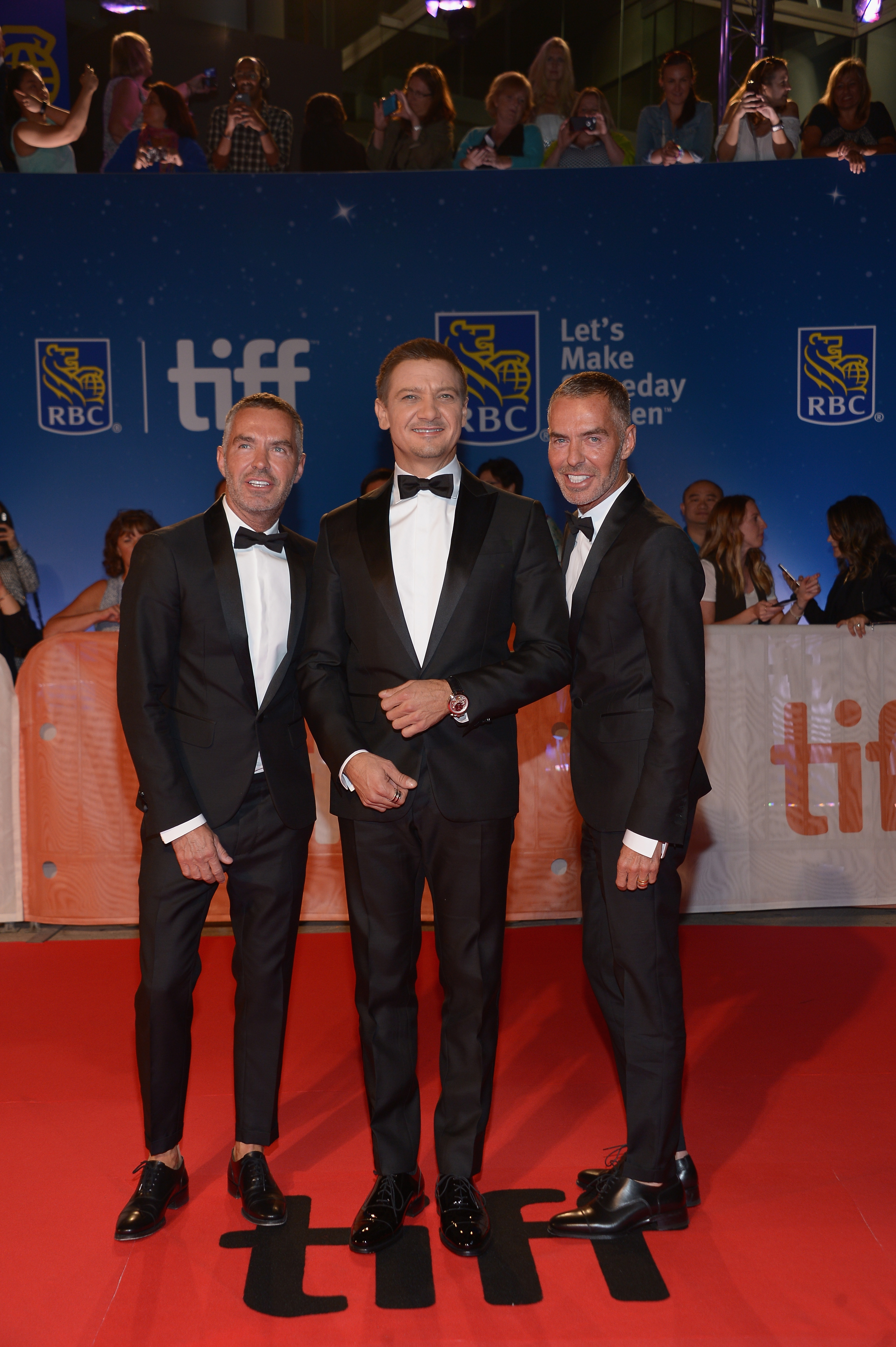 TORONTO, ON - SEPTEMBER 12:  Actor Jeremy Renner (C) with Dean Caten and Dan Caten at the "Arrival" premiere during the 2016 Toronto International Film Festival at Roy Thomson Hall on September 12, 2016 in Toronto, Canada.  (Photo by GP Images/WireImage)