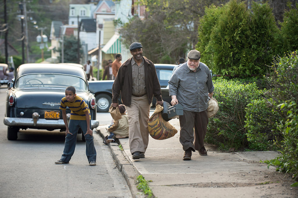 Denzel Washington plays Troy Maxson and Stephen McKinley Henderson plays Jim Bono in Fences from Paramount Pictures.