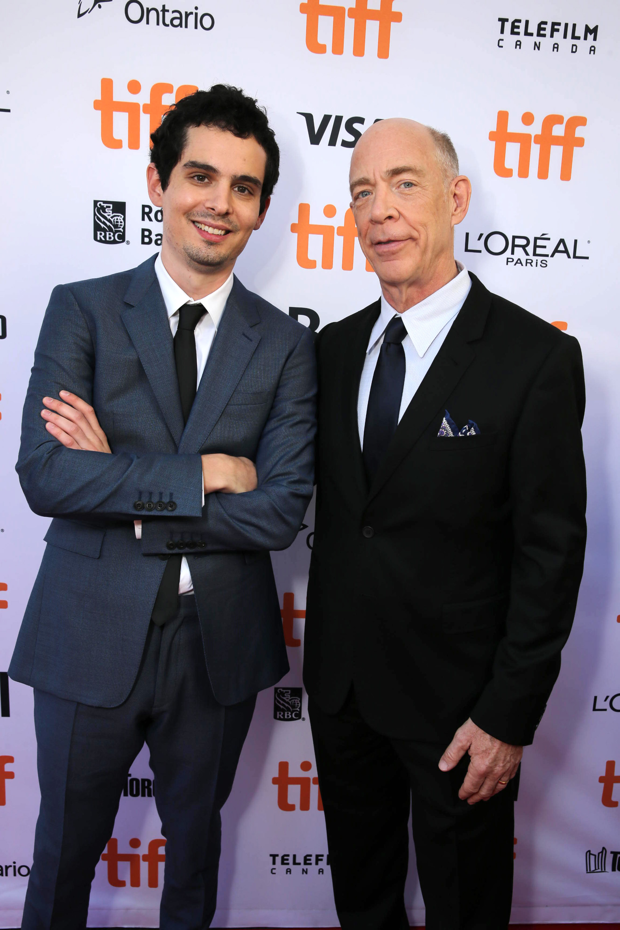 Writer/Director Damien Chazelle and J.K. Simmons seen at Summit Entertainment's "La La Land" premiere at the 2016 Toronto International Film Festival on Monday, Sept. 12, 2016, in Toronto. (Photo by Eric Charbonneau/Invision for LionsgateAP Images)