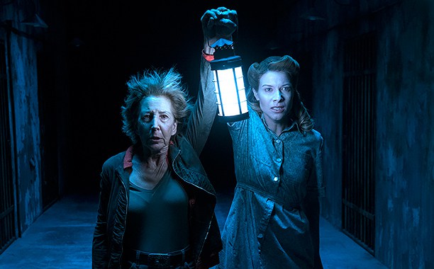 (L to R) LIN SHAYE as Elise and TESSA FERRER as Audrey in "INSIDIOUS: CHAPTER 4," in which the creative minds behind the hit "INSIDIOUS" trilogy return.  The supernatural thriller welcomes back franchise standout Shaye as the brilliant parapsychologist.